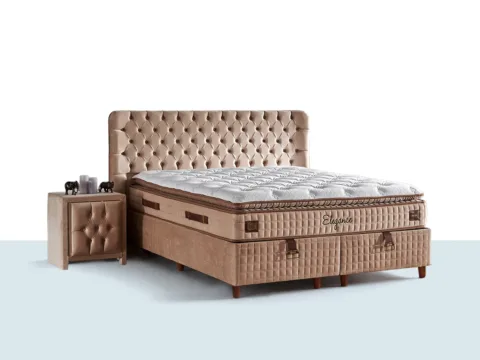 Niron Prime Elegance yatak seti, kapitone başlık ve krem tonlu sandıklı baza ile yatak odasında sade ve dengeli bir görünüm sunar.